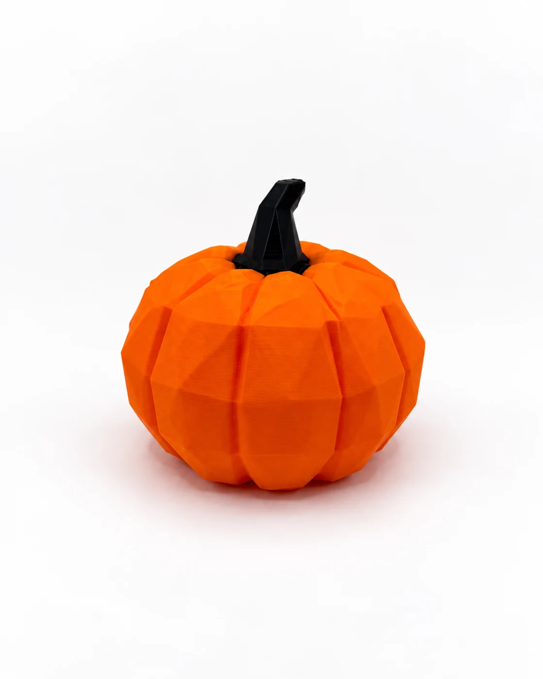 Orange low-poly pumpkin with a black stem on a white background